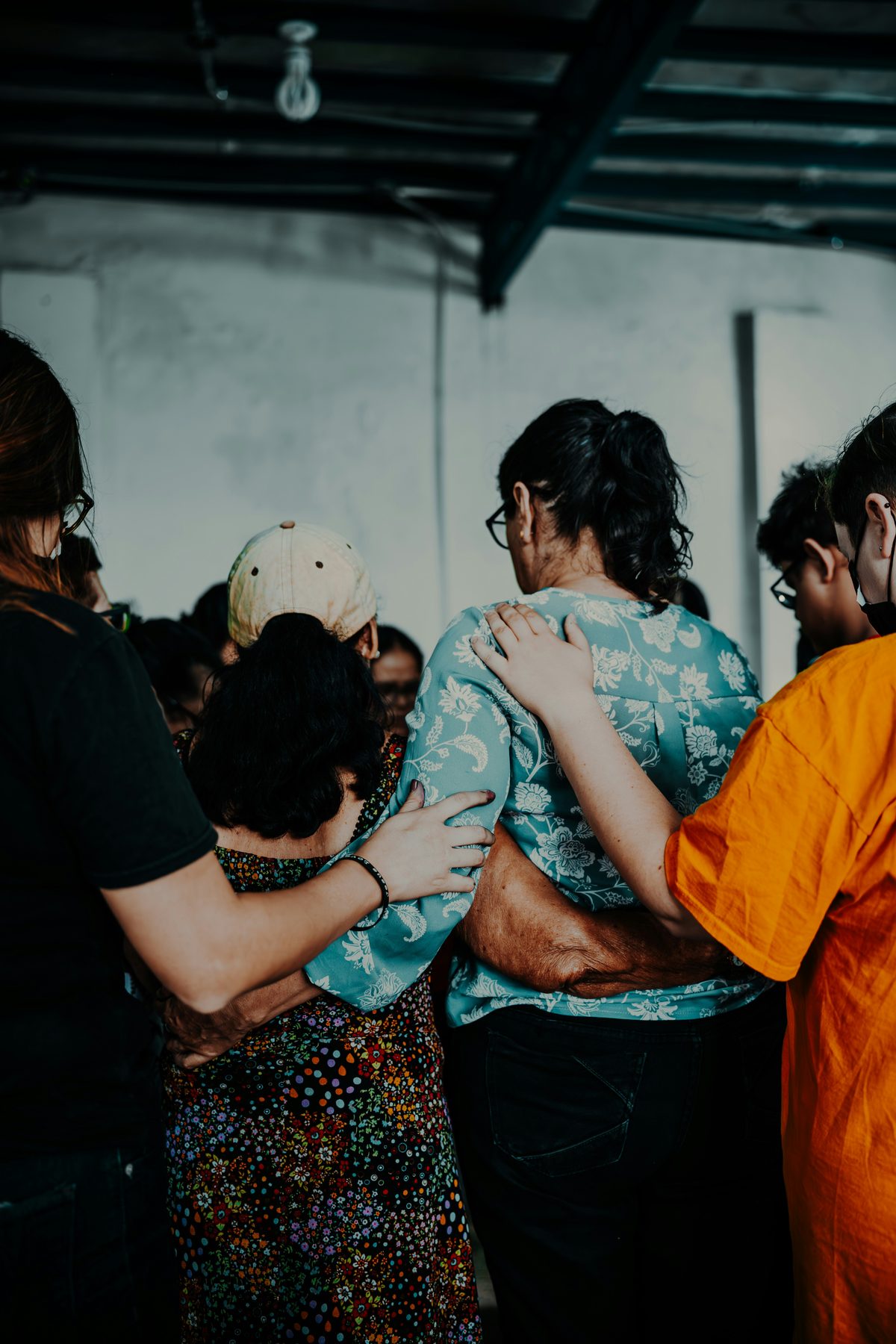 Hands joined together in a show of community support